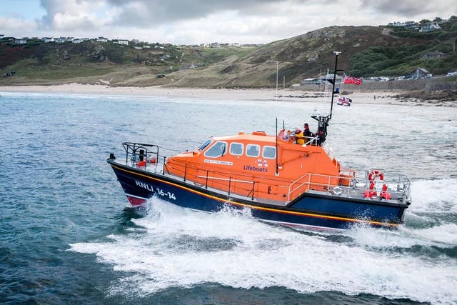 Lifeboat crews said the boy had done exactly what everyone should do when swept out to sea