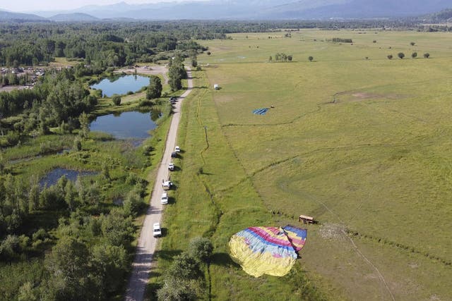 Two of three sightseeing balloons that crashed are seen in an open area of Jackson Hole in western Wyoming. Between 16 and 20 people were hurt, officials said