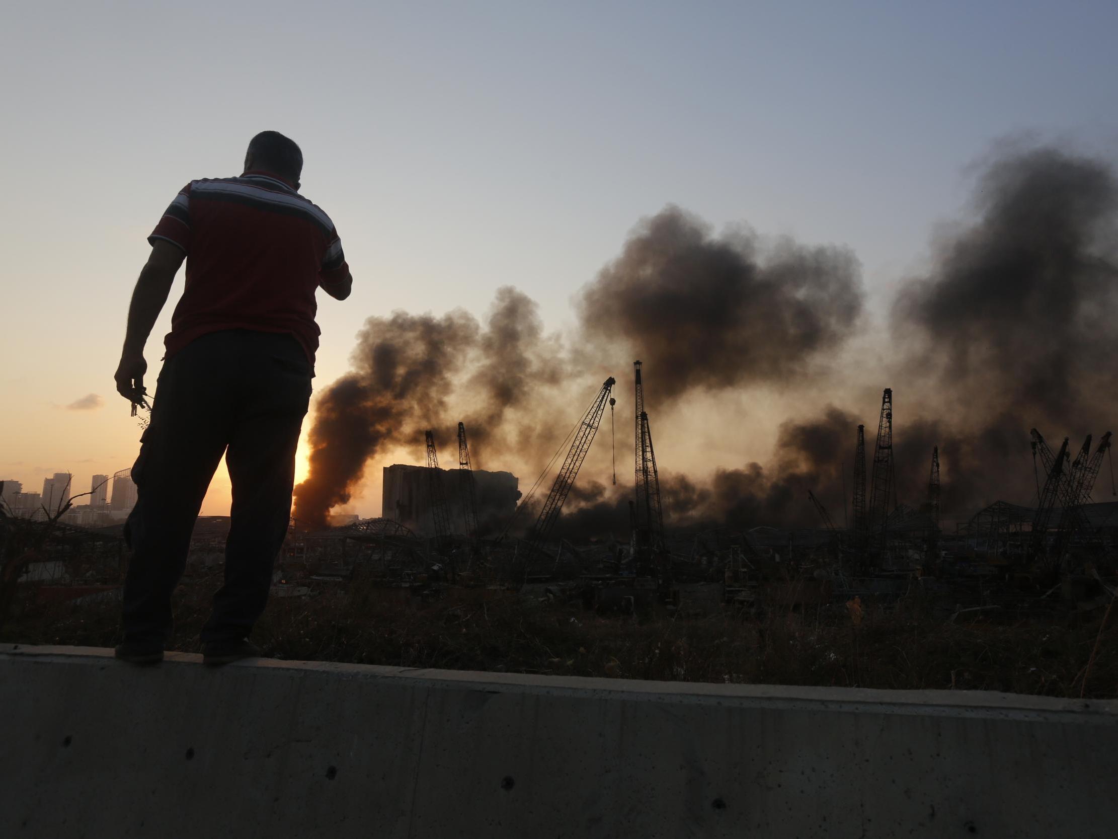 Smoke rises from a port facility after large explosions on August 4, 2020 in Beirut, Lebanon