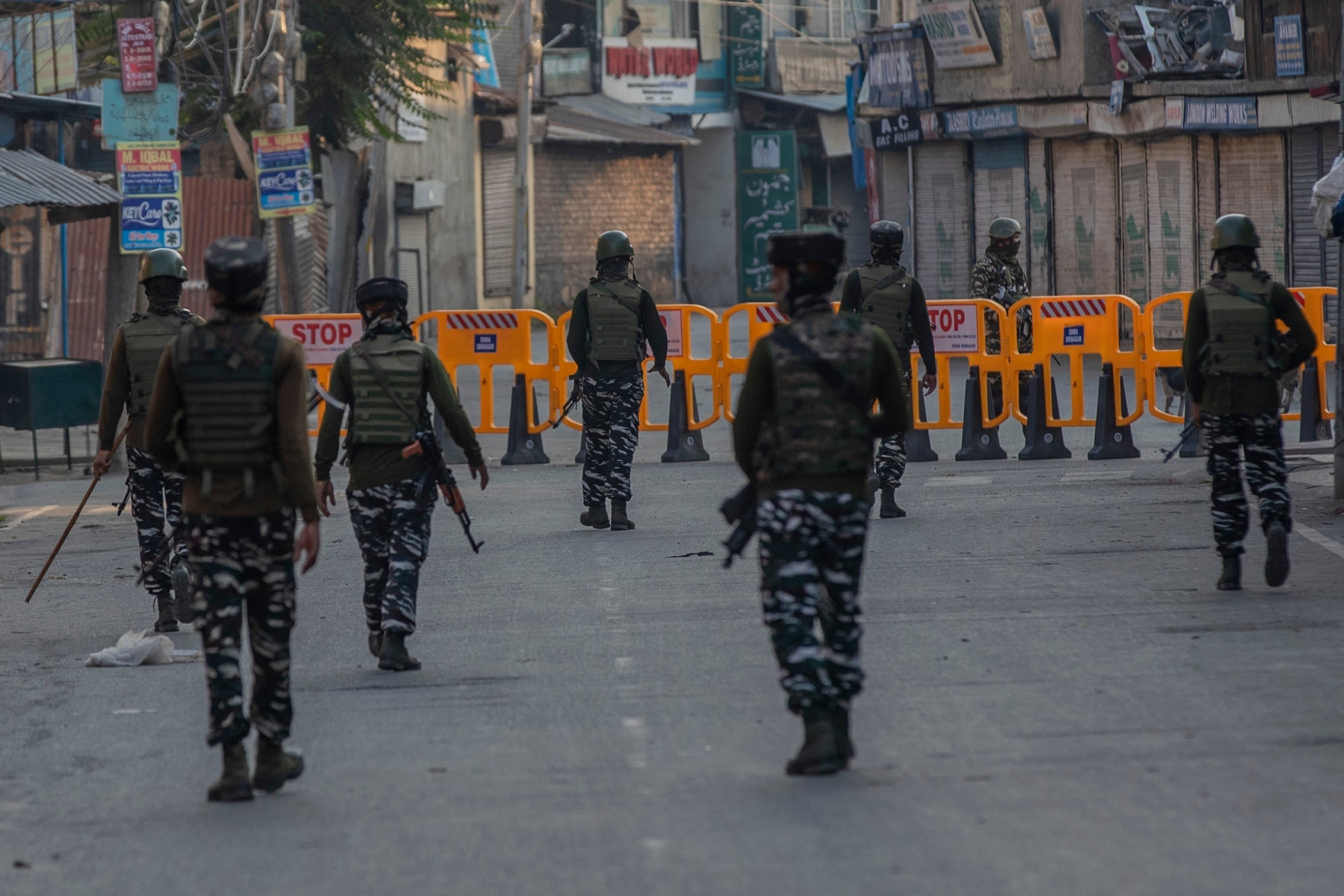 Paramilitary soldiers patrol a deserted street on the first anniversary of India’s decision to revoke the disputed region’s semi-autonomy, in Srinagar on Wednesday