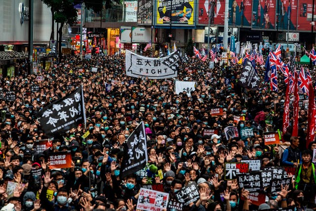 Tens of thousands of protesters march in Hong Kong during a massive pro-democracy rally on New Year’s Day (A