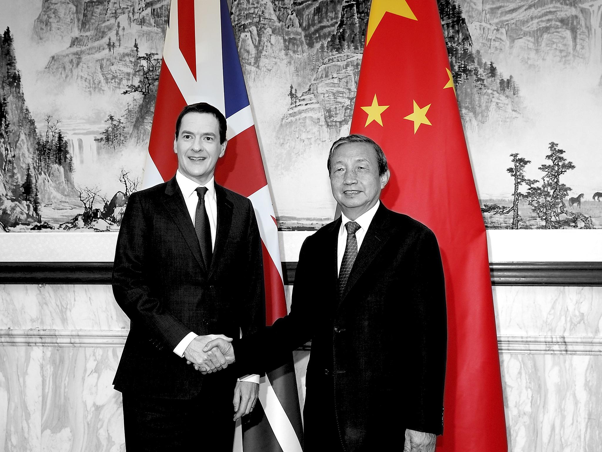Chinese vice president Ma Kai shakes hands with George Osborne, the then chancellor of the exchequer, in Beijing in September 2015