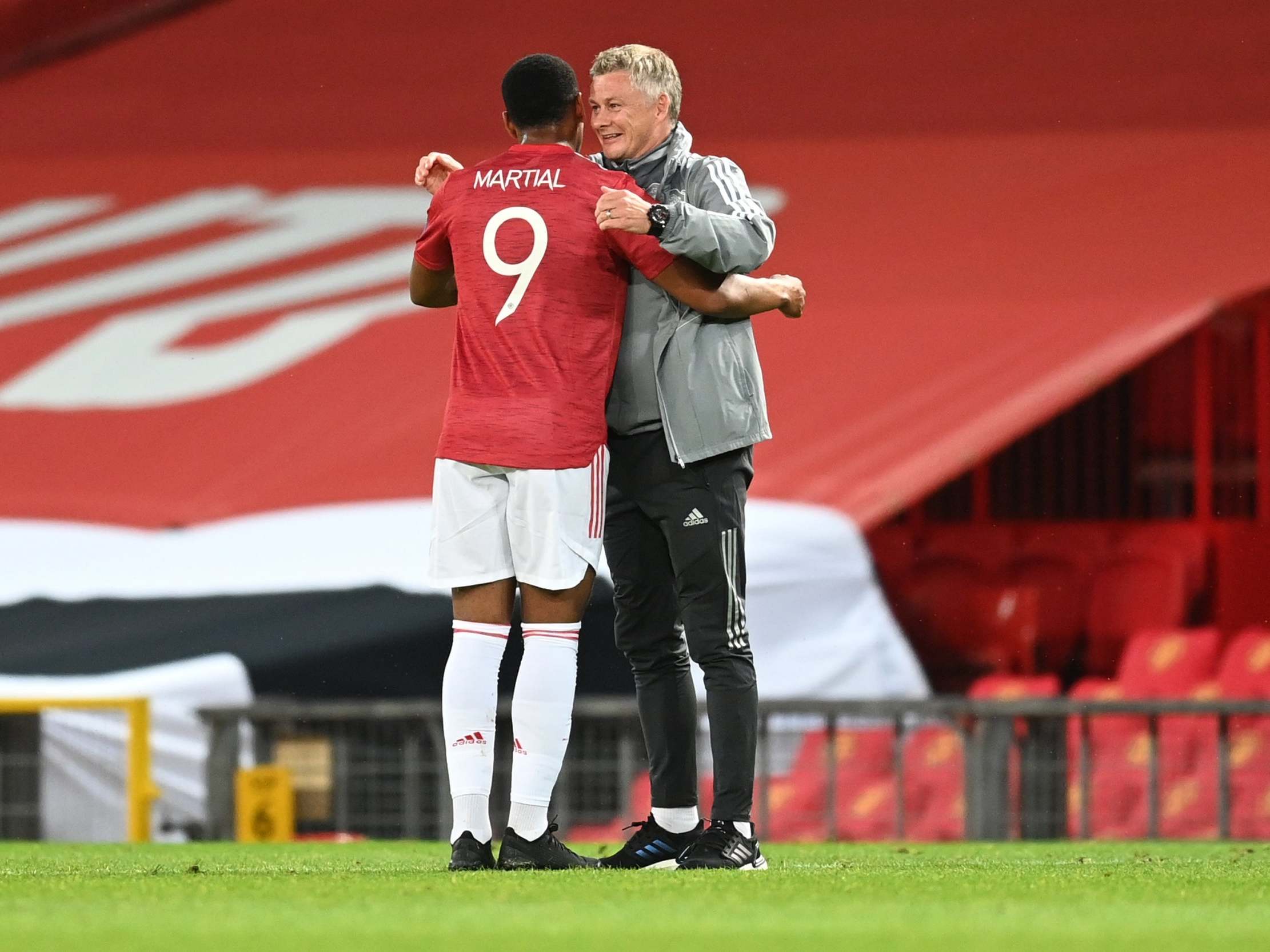 Anthony Martial and Ole Gunnar Solskjaer embrace at full-time
