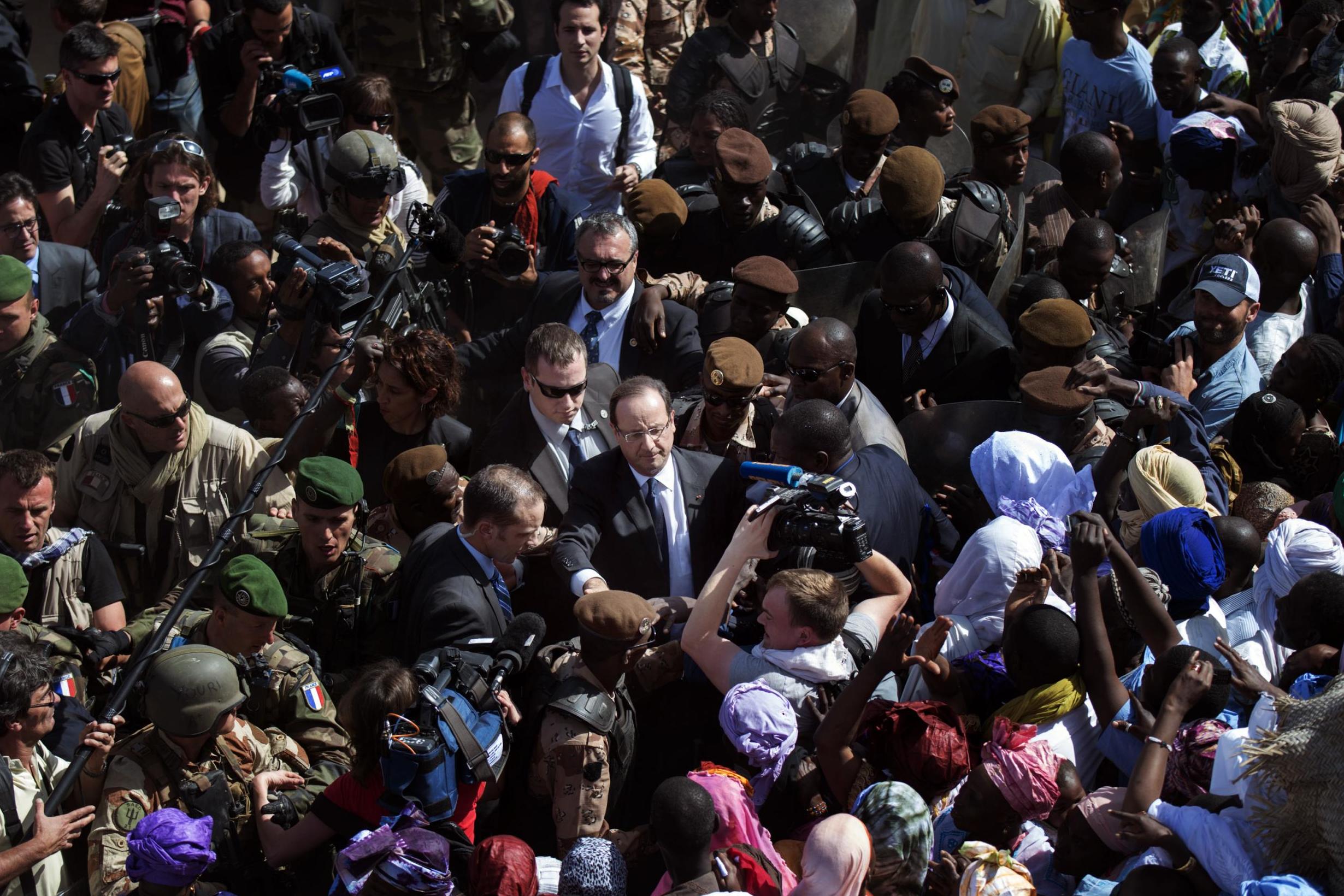 Hollande arriving in Timbuktu in 2013