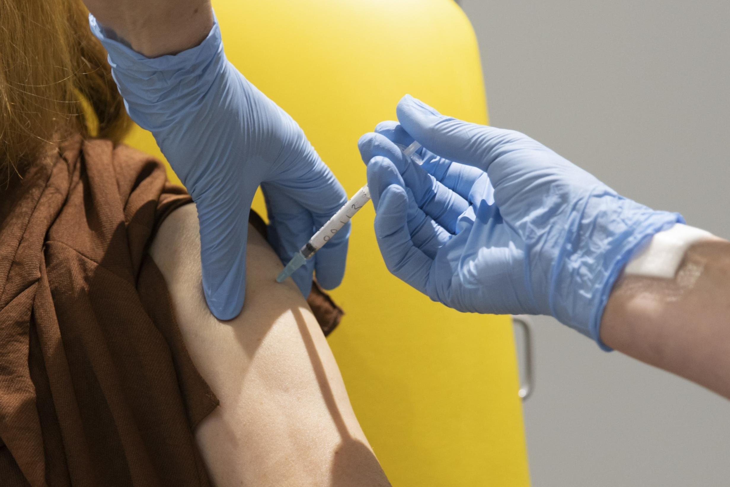 File: A volunteer participates in a vaccine trial