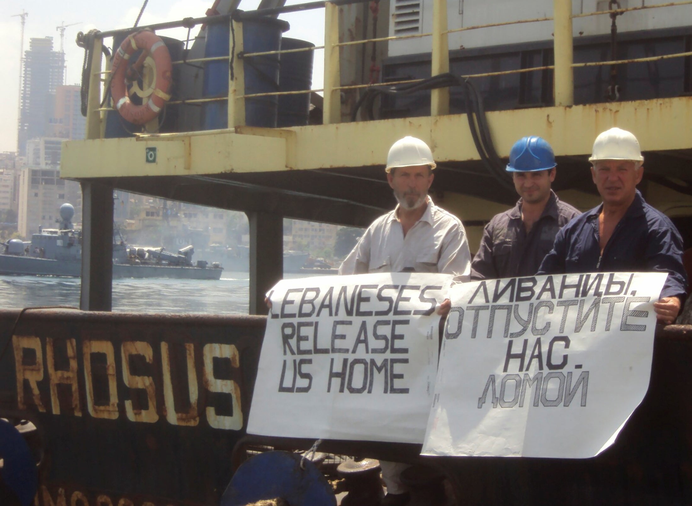 Captain Boris Prokoshev and crew members demand their release from the arrested cargo vessel Rhosus in the port of Beirut in summer 2014
