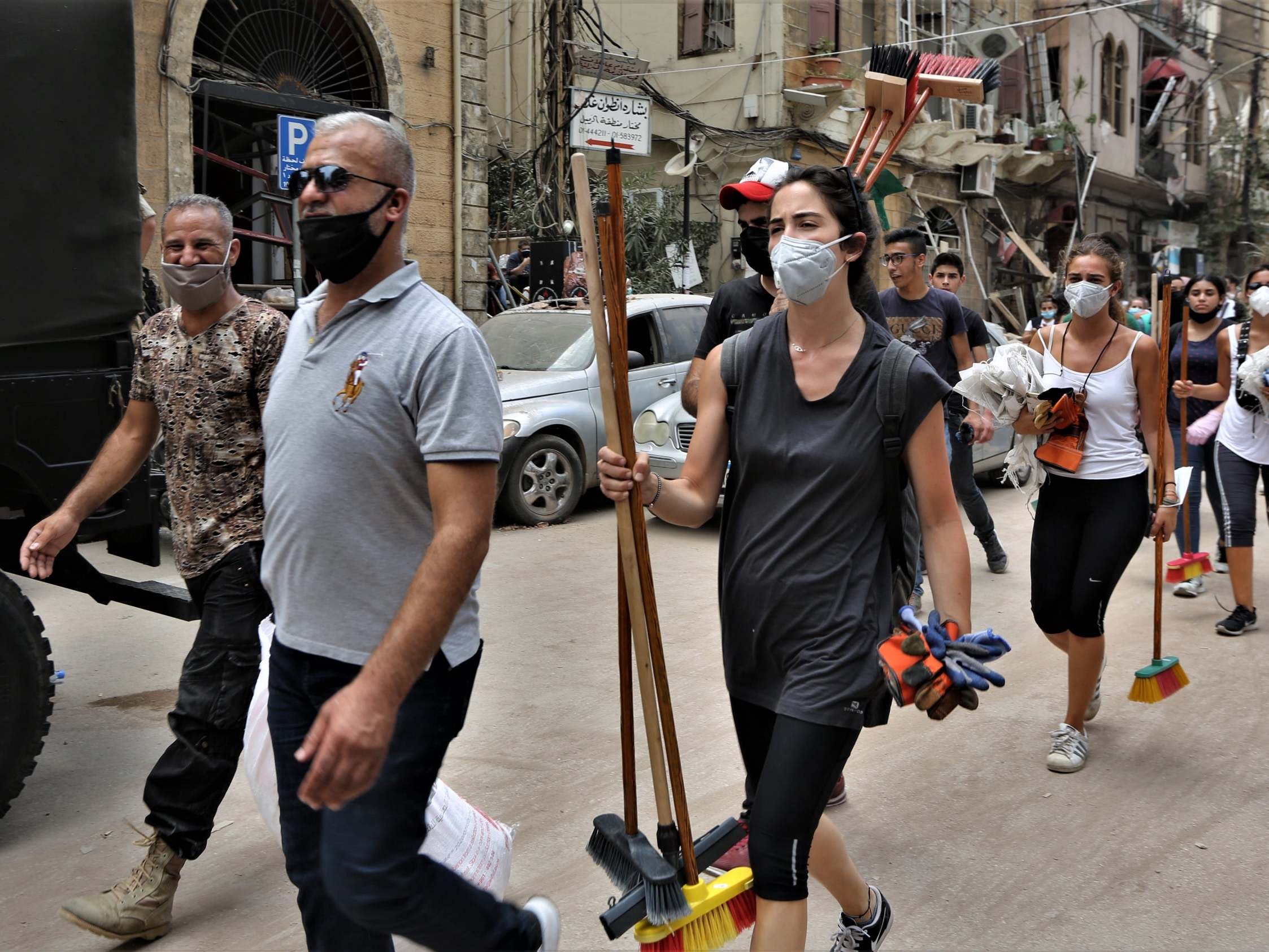 Volunteers remove the rubble in the damaged Al-Gemayzeh area in Beirut