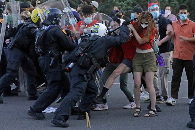 Police and protesters clash at a Black Lives Matter demonstration in Salt Lake City