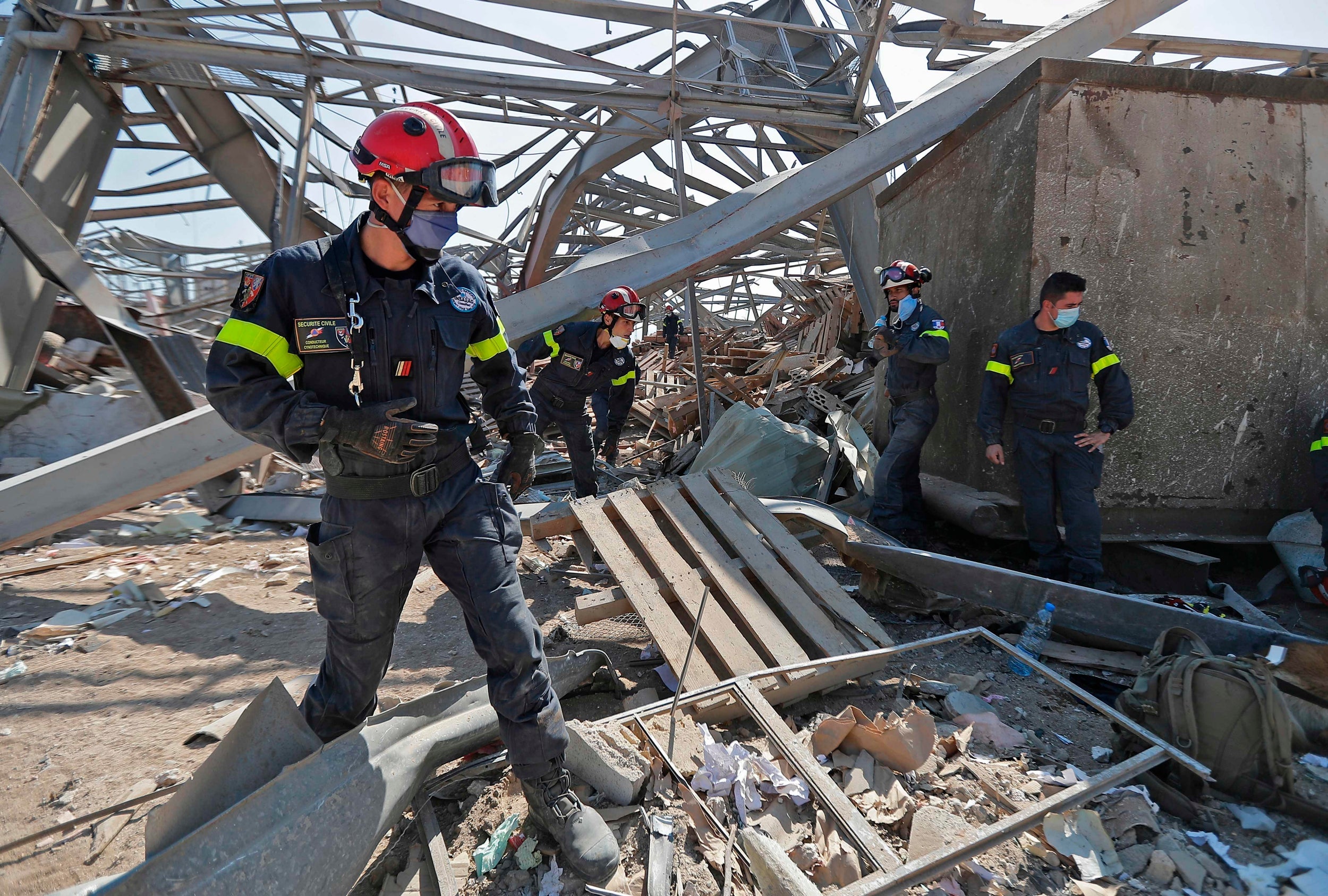 French rescue workers search through the rubble in the devastated Beirut port on Friday