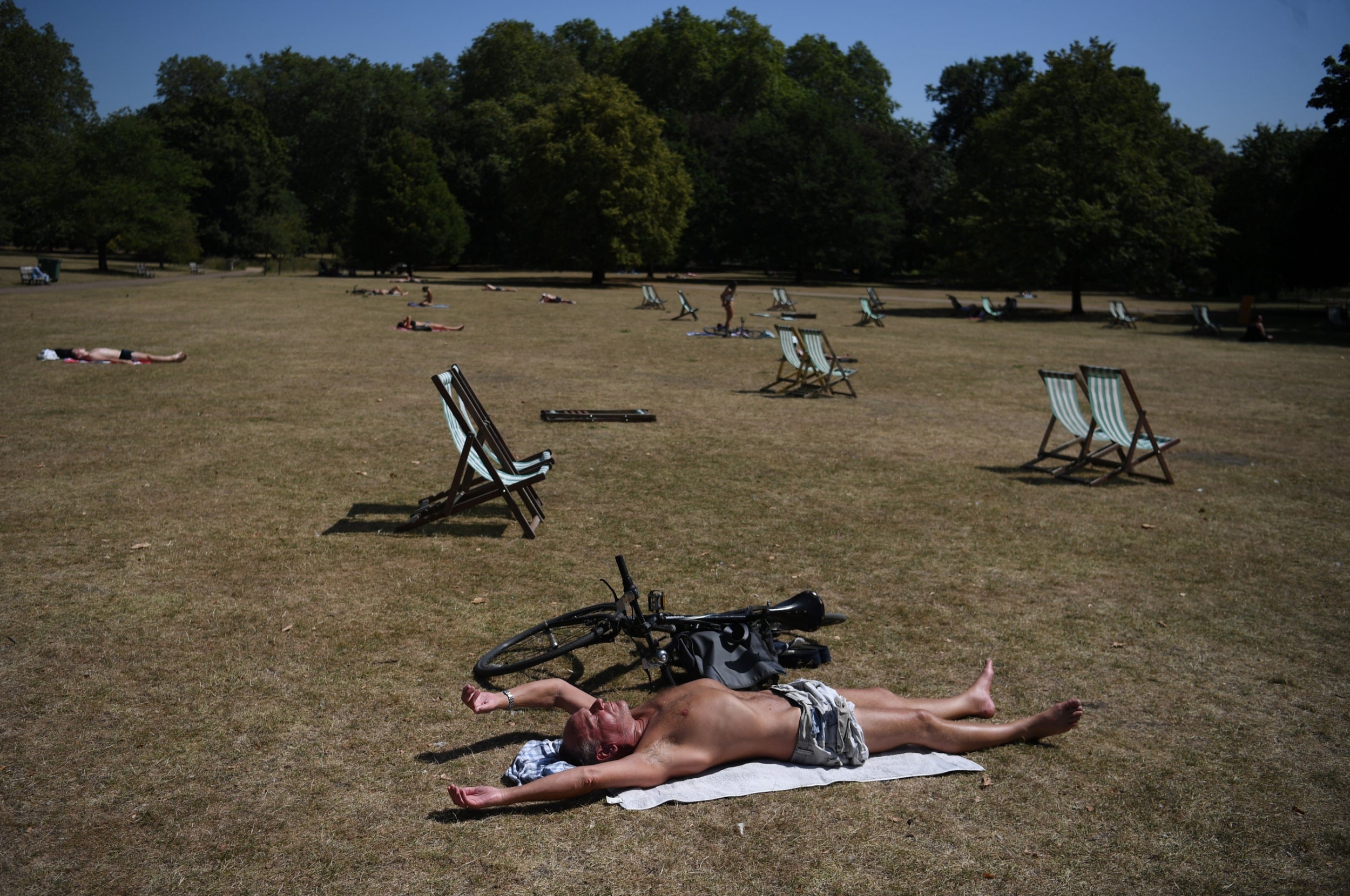 Sunbathers keep their distance in London’s St James’s Park