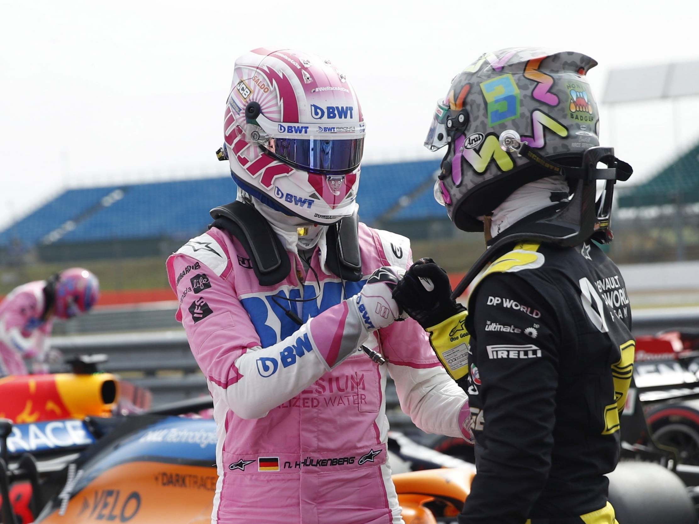 Nico Hulkenberg is congratulated by Daniel Ricciardo after qualifying third