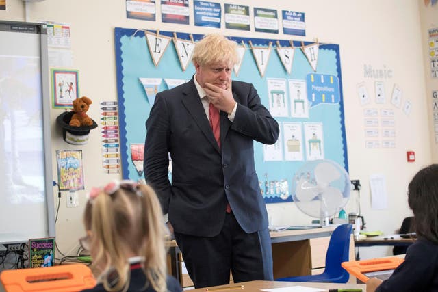 Boris Johnson reacts during a visit to The Discovery School, Kent in July. The PM has urged for schools to fully reopen by September