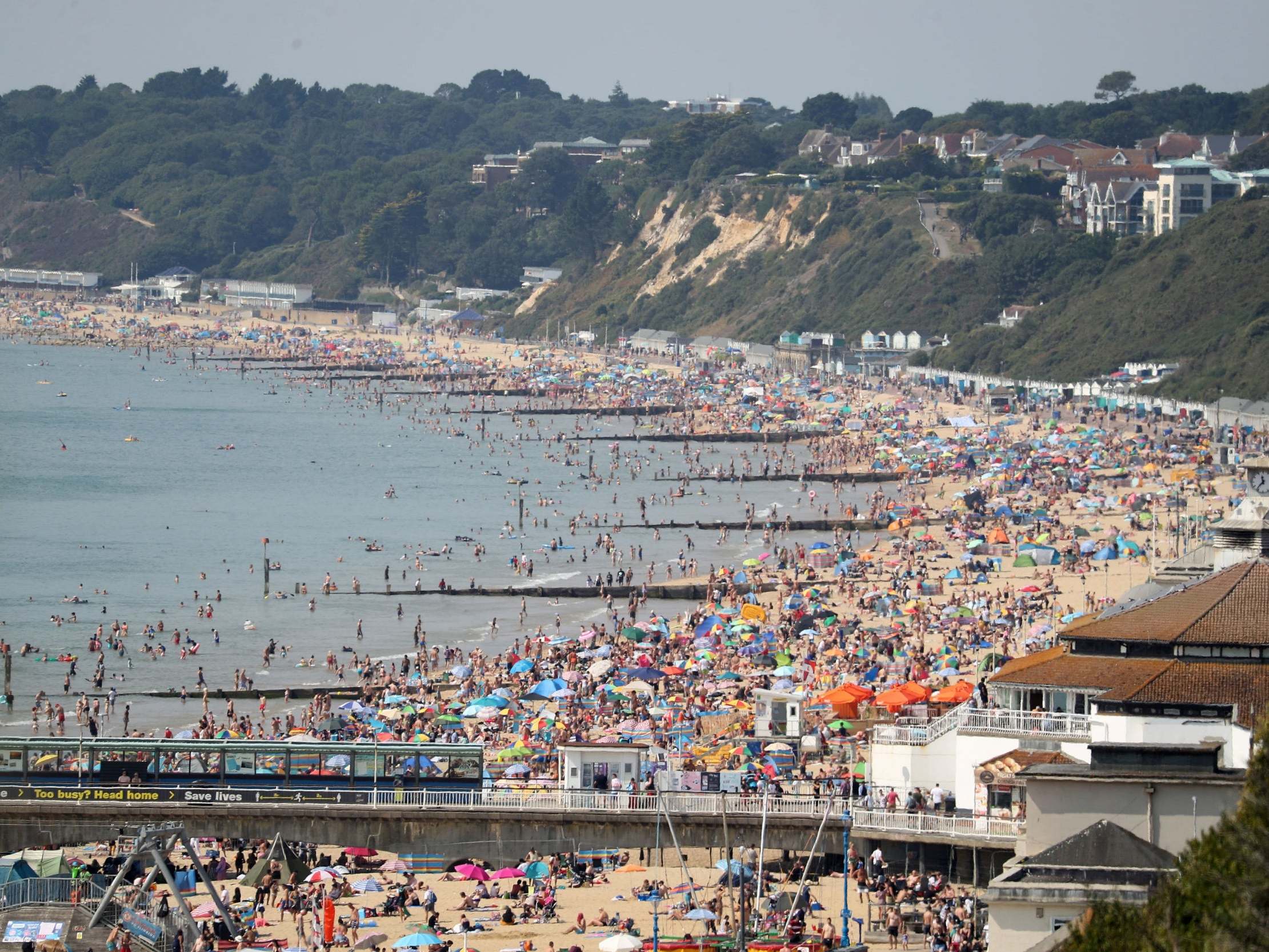 People enjoy the hot weather at Bournemouth beach in Dorset