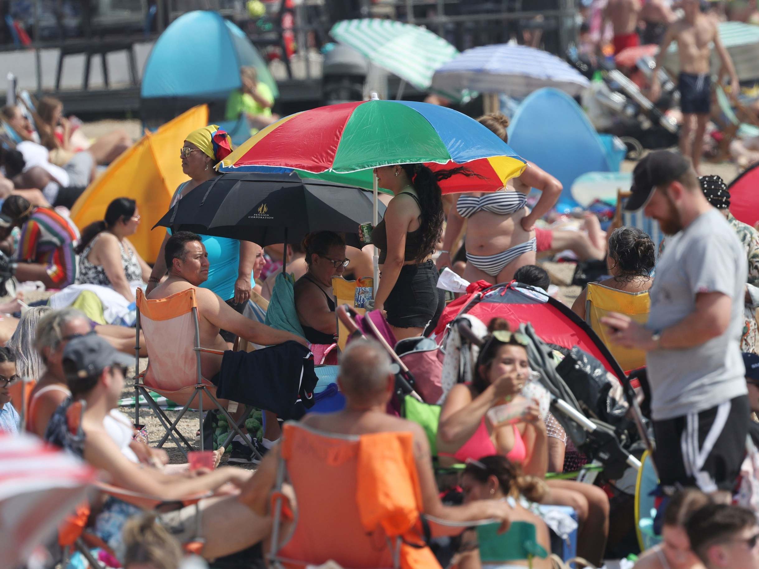 People enjoy the hot weather at Southend beach in Essex