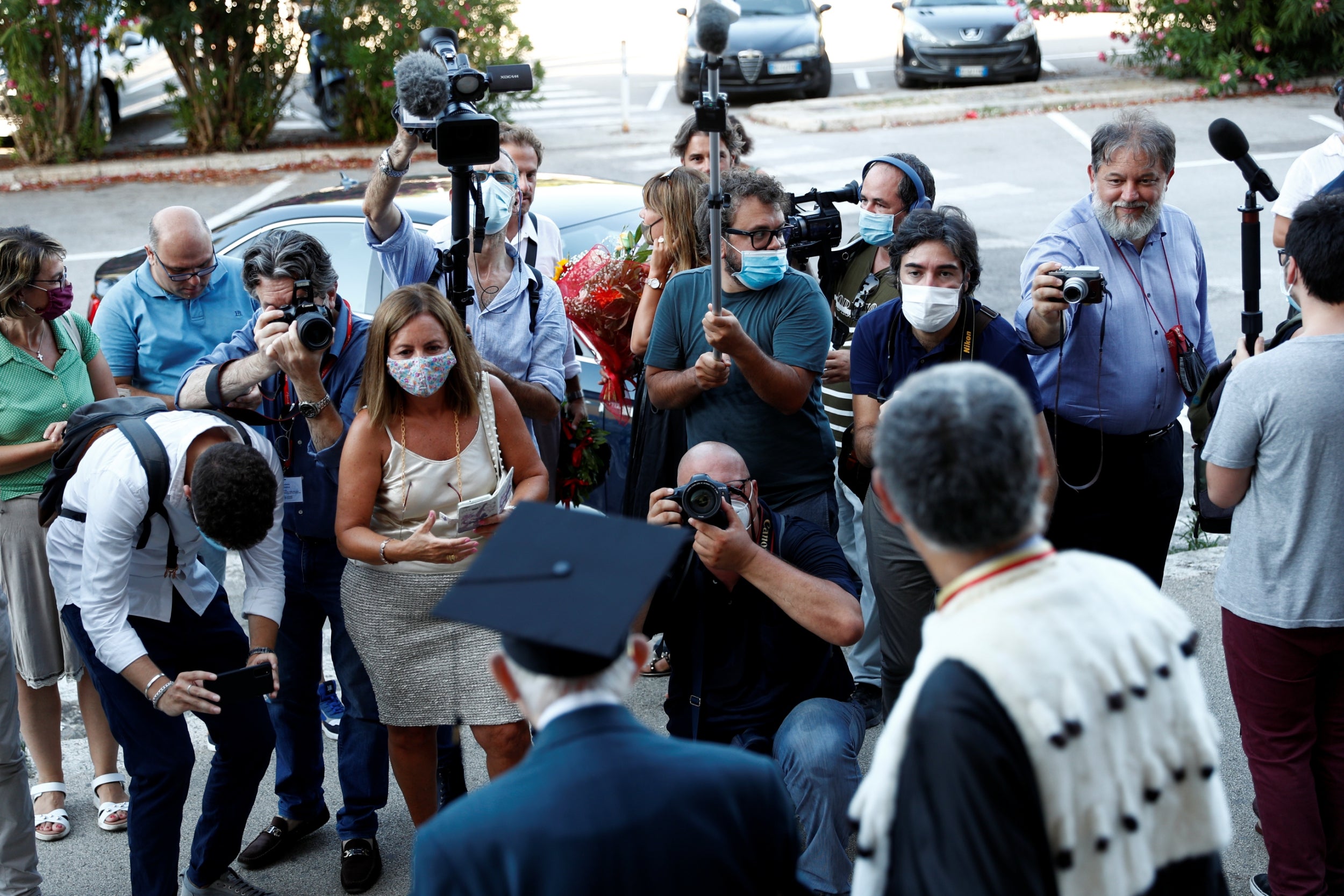 The media take pictures after his graduation