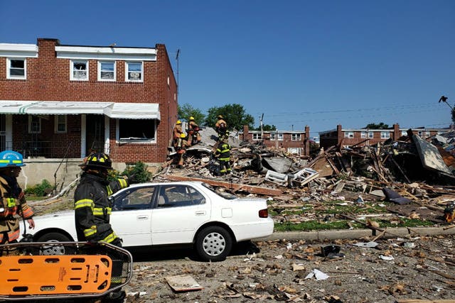 Firefighters respond to a major gas explosion that destroyed three homes in a Baltimore neighbourhood.