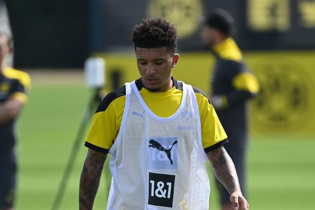 Borussia Dortmund's Jadon Sancho dribbles a ball