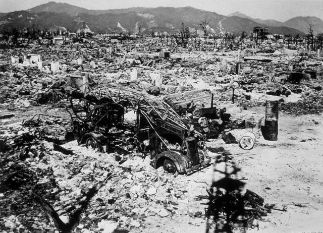 Atomic bomb damage at Hiroshima with a burnt out fire engine amidst the rubble in 1945