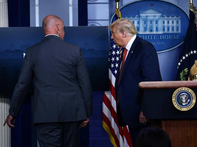 Donald Trump removed by member of the secret service from the Brady Briefing Room of the White House