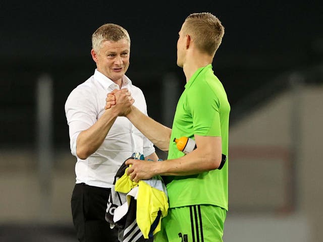 Ole Gunnar Solskjaer congratulates FC Copenhagen goalkeeper Karl-Johan Johnsson for his performance
