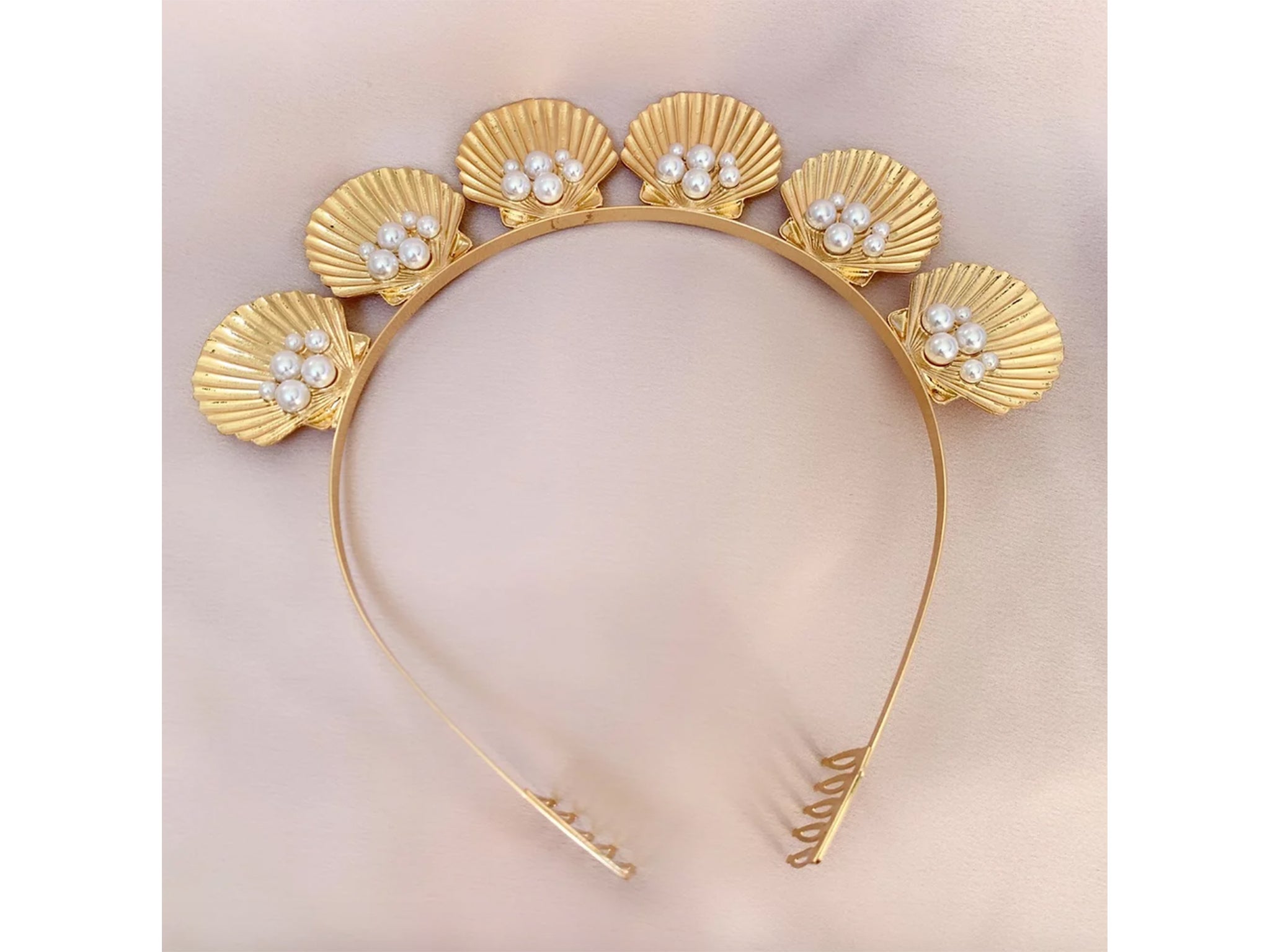 An ode to the seaside, we love the pearl detailing on this gold band