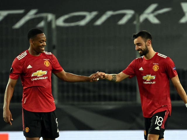 Manchester United's Bruno Fernandes (right) celebrates scoring with Anthony Martial