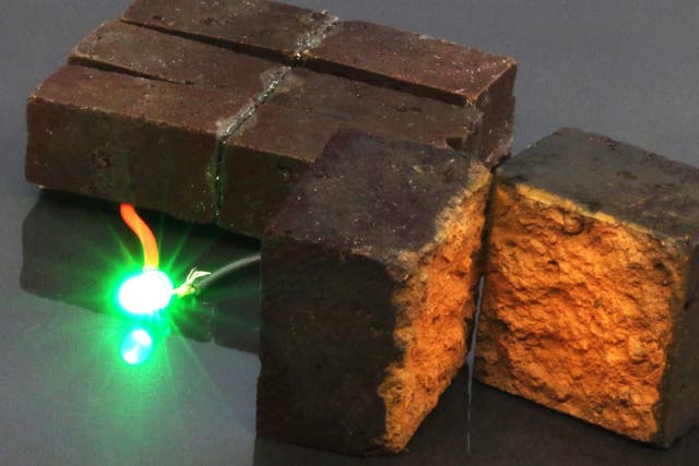 The researchers powered a green LED using their Pedot-coated bricks