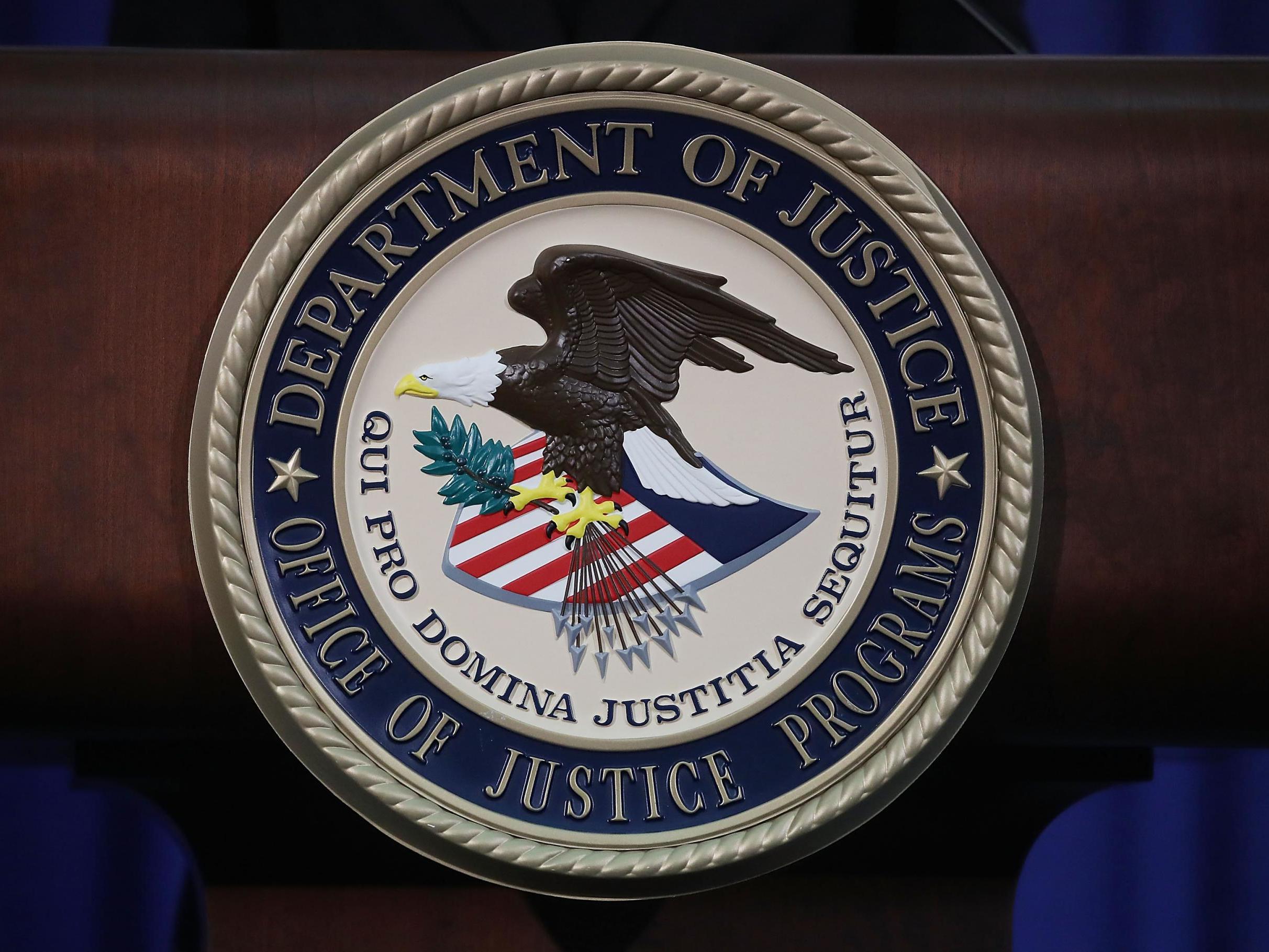 The Justice Department seal is seen on the lectern during a Hate Crimes Subcommittee summit on 29 June 2017 in Washington, DC