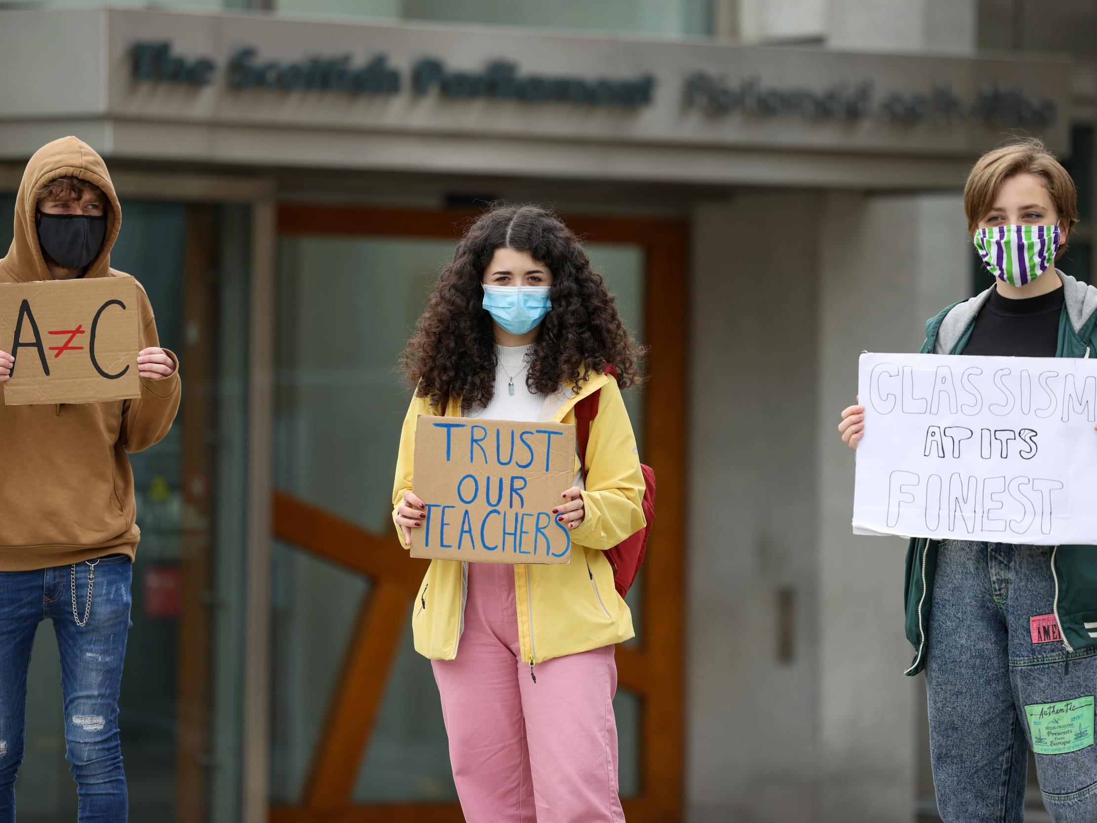 Pupils demonstrate outside the Scottish parliament over last week’s downgrading of exam results by the Scottish Qualifications Authority (Getty)