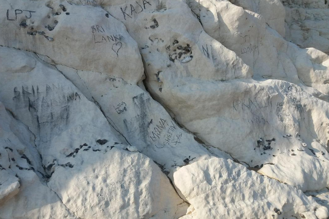The cliffs at Durdle Door are regularly defaced