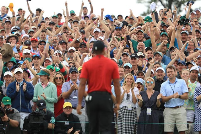 The crowd at Augusta National Golf Club reacts as Tiger Woods wins the tournament in 2019