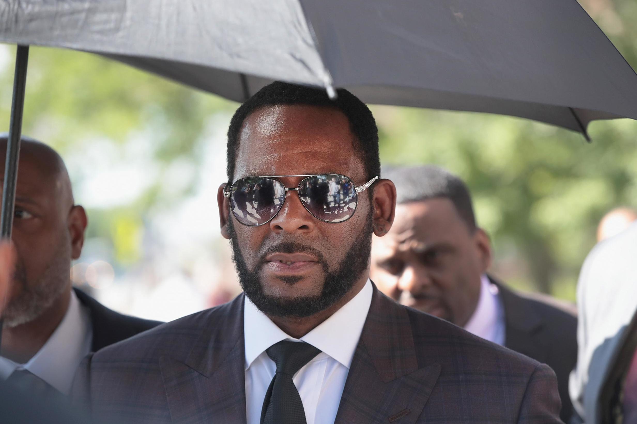 R. Kelly leaves a court hearing in Chicago. The embattled singer's trial is finally approaching.