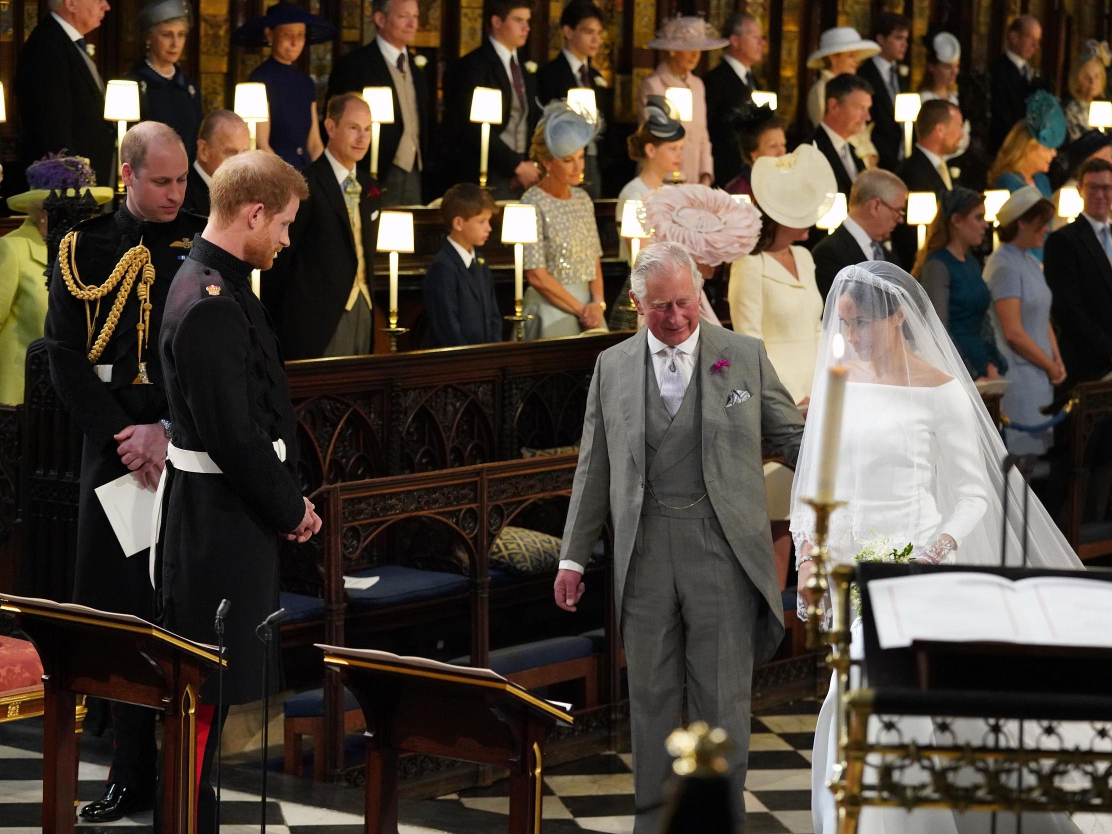 Meghan Markle is accompanied by Prince Charles down the aisle at St George's Chapel in Windsor Castle, 19 May 2018