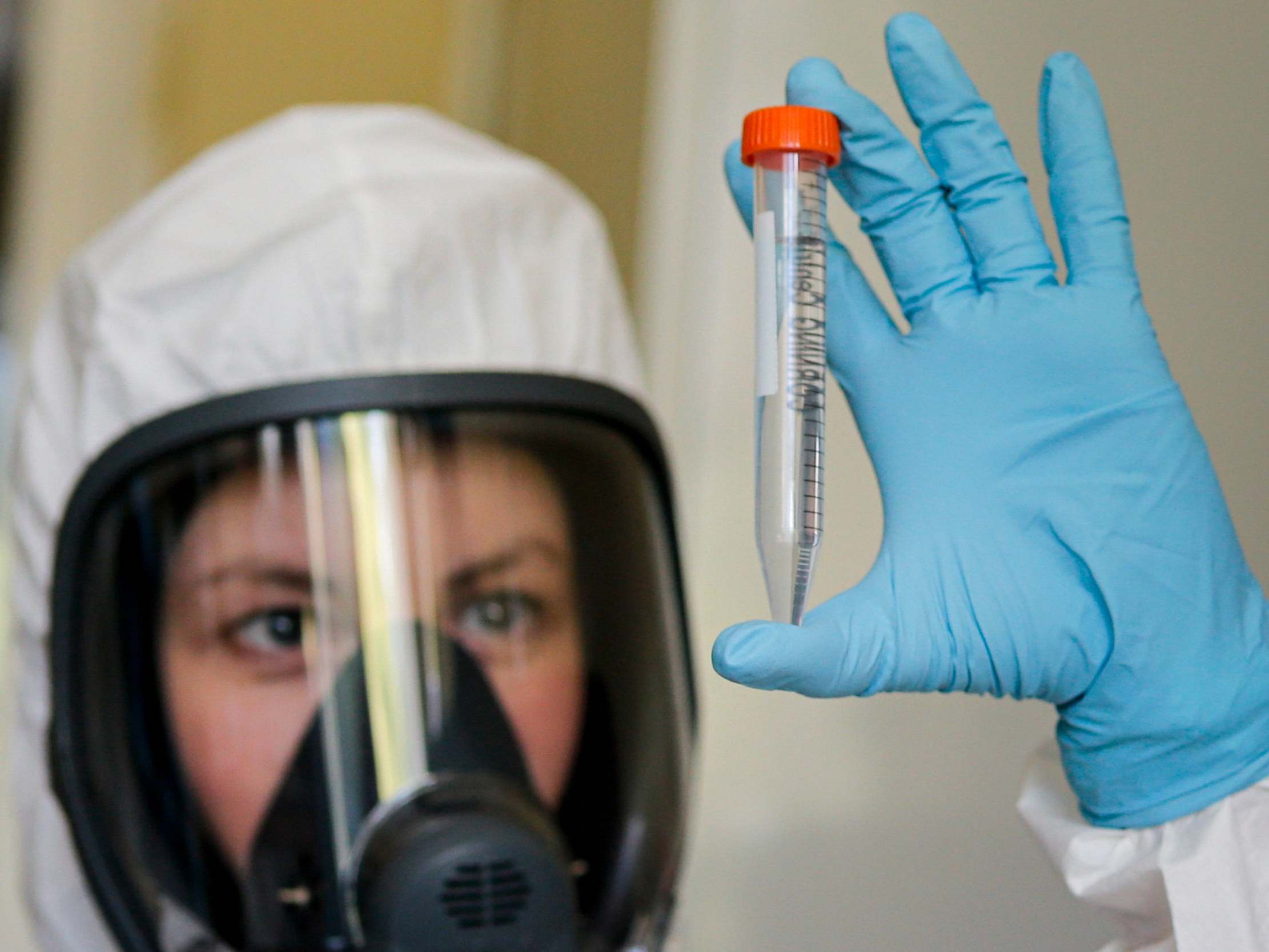 An employee shows new Russian vaccine at the Nikolai Gamaleya National Centre of Epidemiology and Microbiology in Moscow