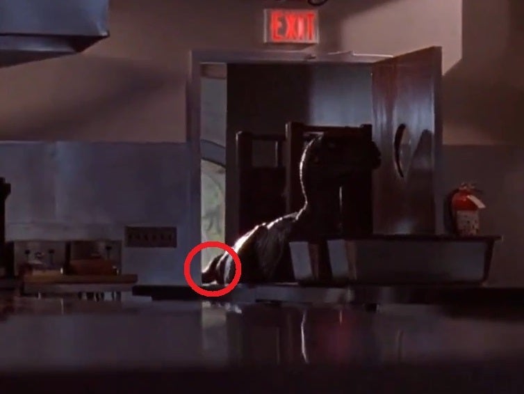 An operator’s hand can be seen holding the dinosaur’s tail in this ‘Jurassic Park’ scene