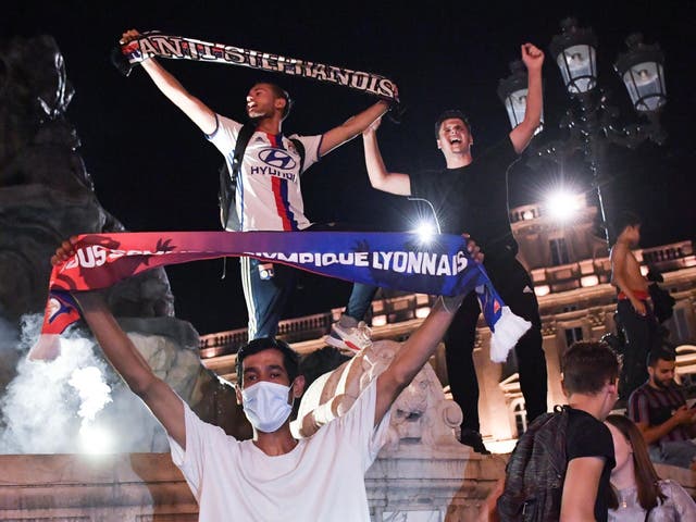 Lyon fans celebrate victory over Juventus in the streets of Lyon