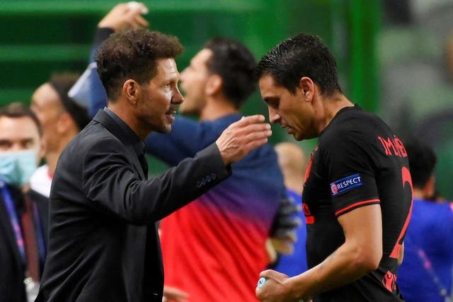 Atletico Madrid coach Diego Simeone (left) and Jose Gimenez after their Champions League elimination