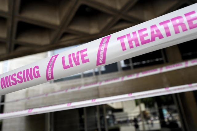 The National Theatre wrapped in pink tape as part of a campaign by #scenechange to help bring shows back into production