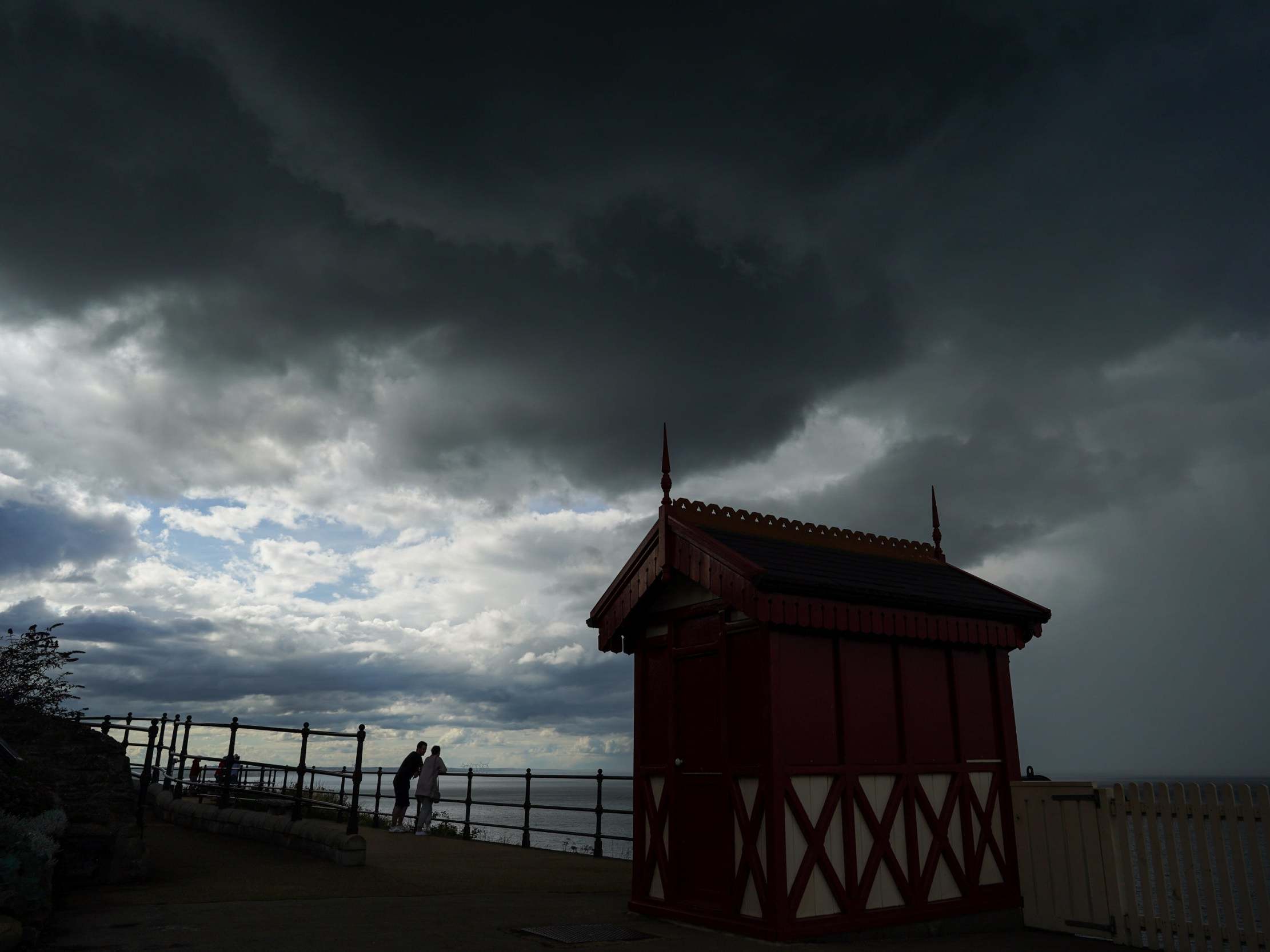 Dark storm clouds pass over the cliff lift in Saltburn By The Sea