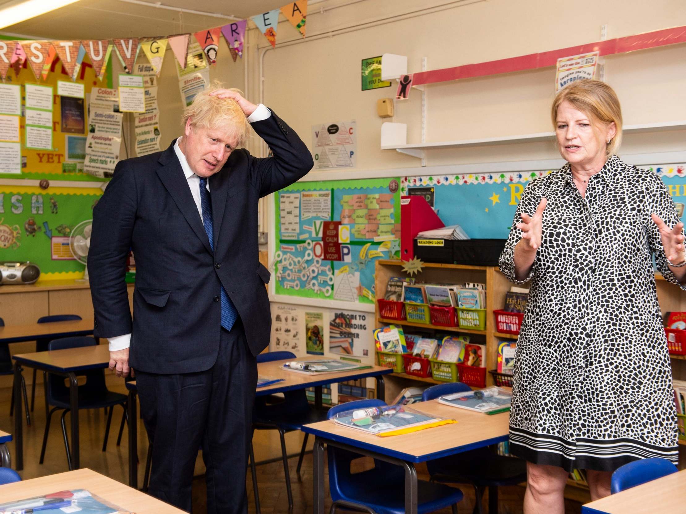 Headteacher Bernadette Matthews shows the PM, during his recent visit to St Joseph's primary in Upminster, measures being implemented to ensure children can return to school safely
