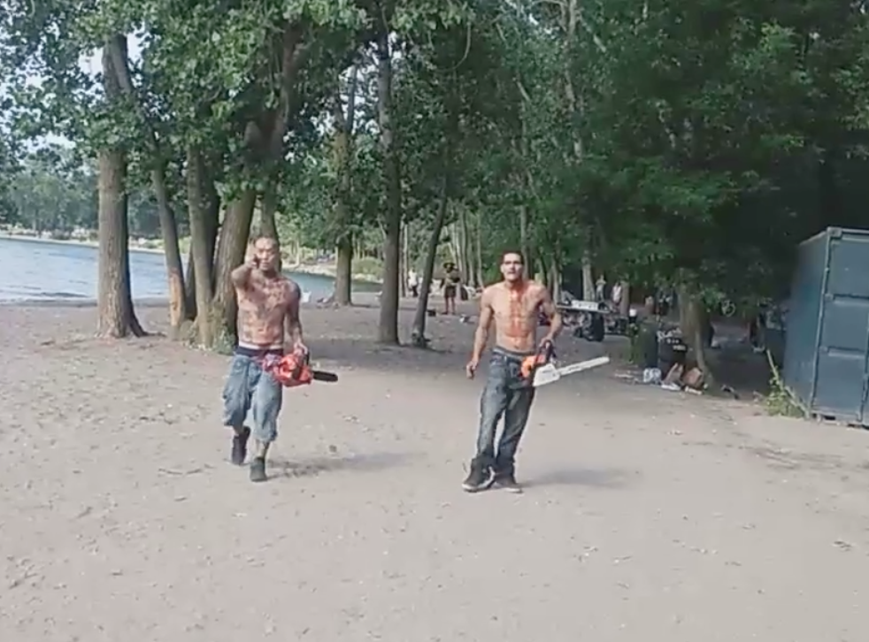 Footage showed two men wielding chainsaws while covered in blood, shouting 'who hit me?'