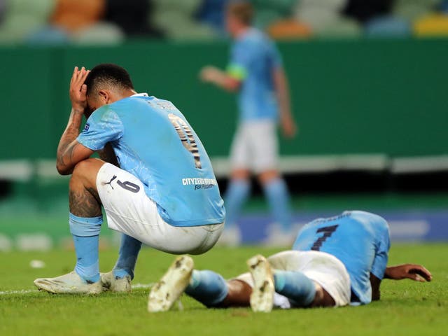 Gabriel Jesus (L) and Raheem Sterling of Manchester City react
