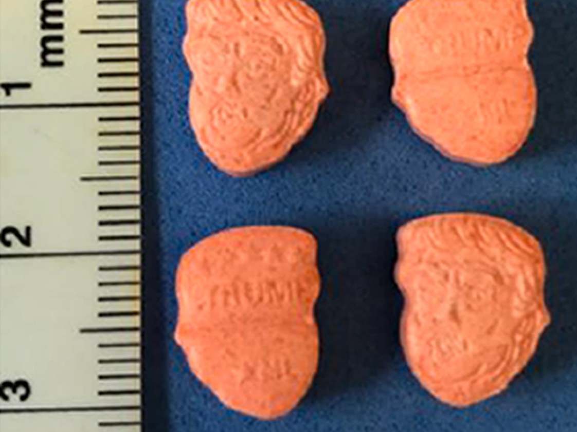 The orange tablets which bear the likeness of the US president were seized in Bedfordshire this week