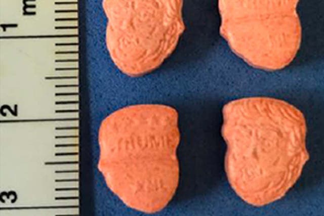 The orange tablets which bear the likeness of the US president were seized in Bedfordshire this week 