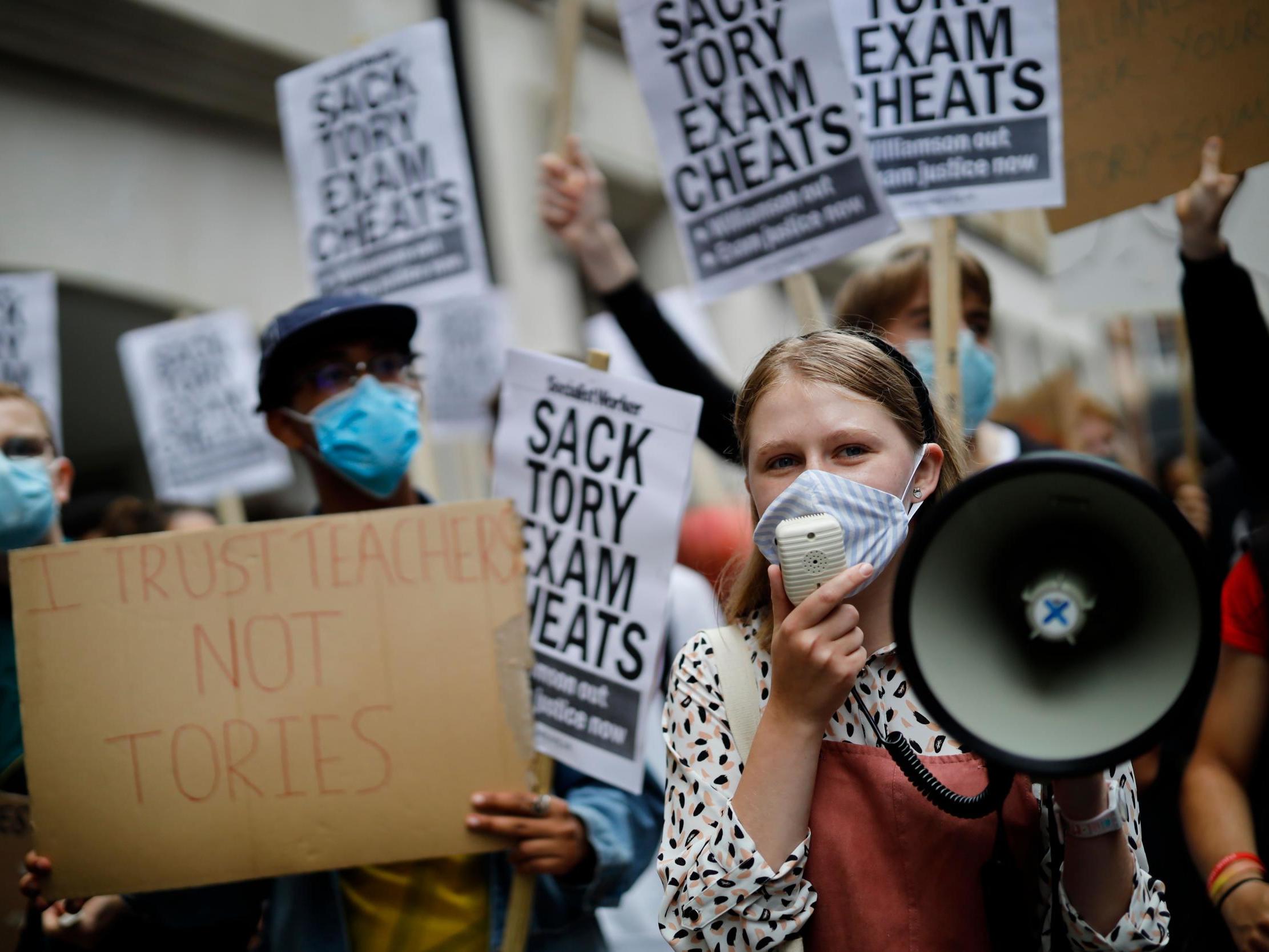 Students protest outside the Department for Education in London on Friday