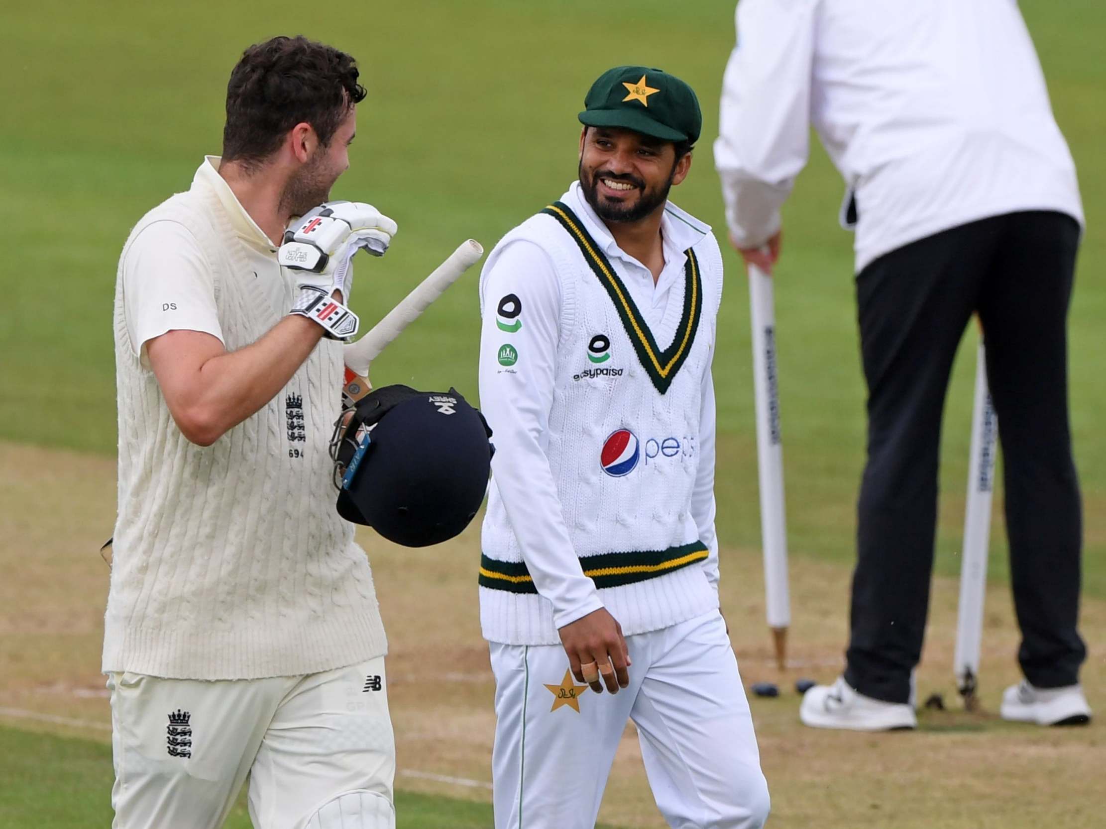 Dom Sibley and Ashar Ali share a joke as rain ends play