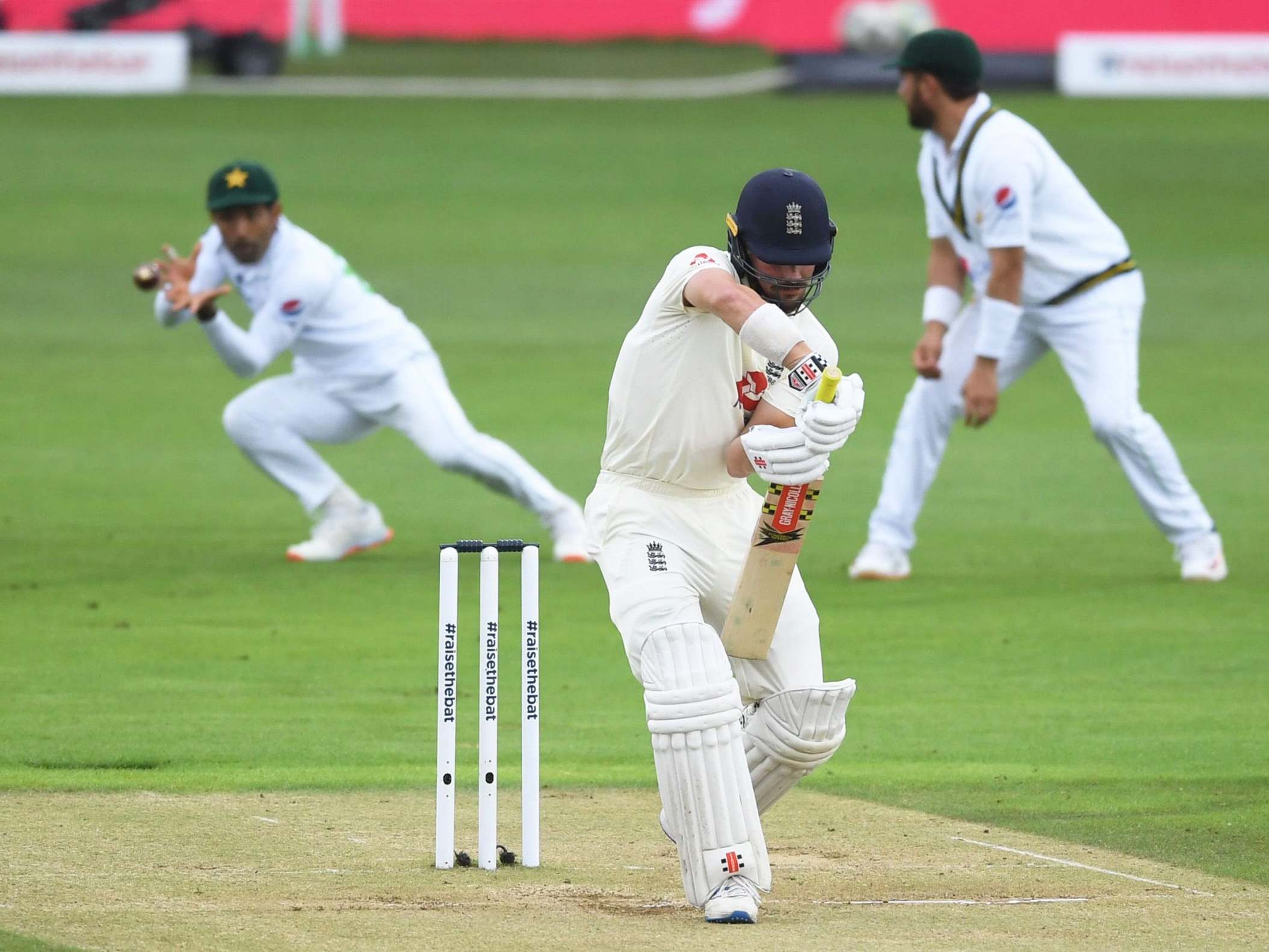 Rory Burns is caught in the slips by Asad Shafiq