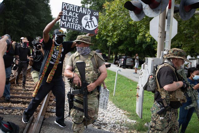 Members of far right militias and white pride organizations rally near Stone Mountain Park in Georgia on August 15