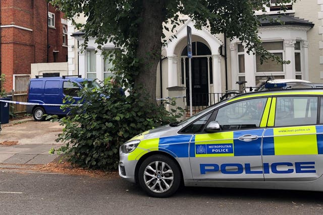 Police outside an address in Cumberland Park, Acton, west London on Sunday