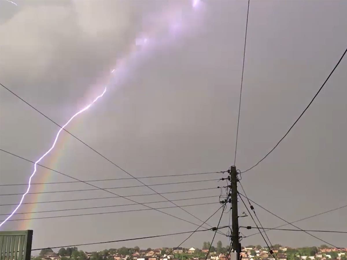 Lightning bolt strikes down curvature of rainbow in stunning video | The  Independent | The Independent